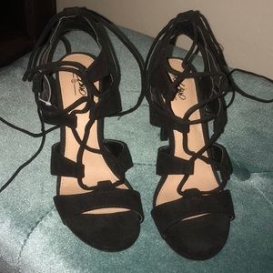 Black single sole lace up heels.